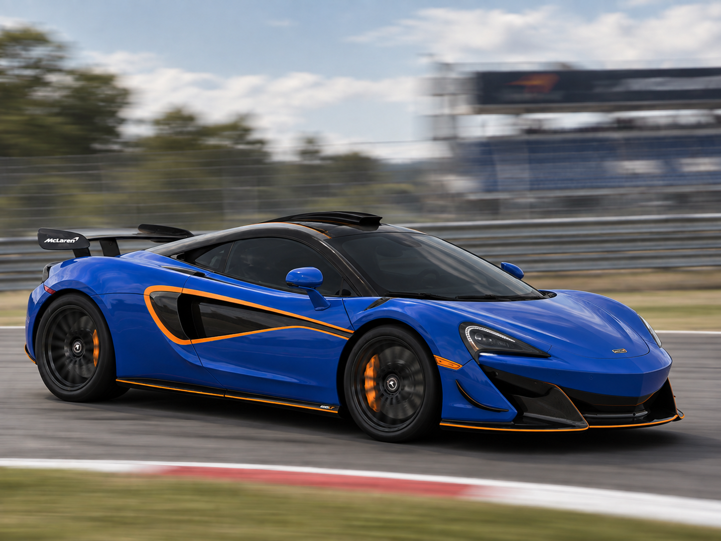 Blue McLaren on circuit at speed