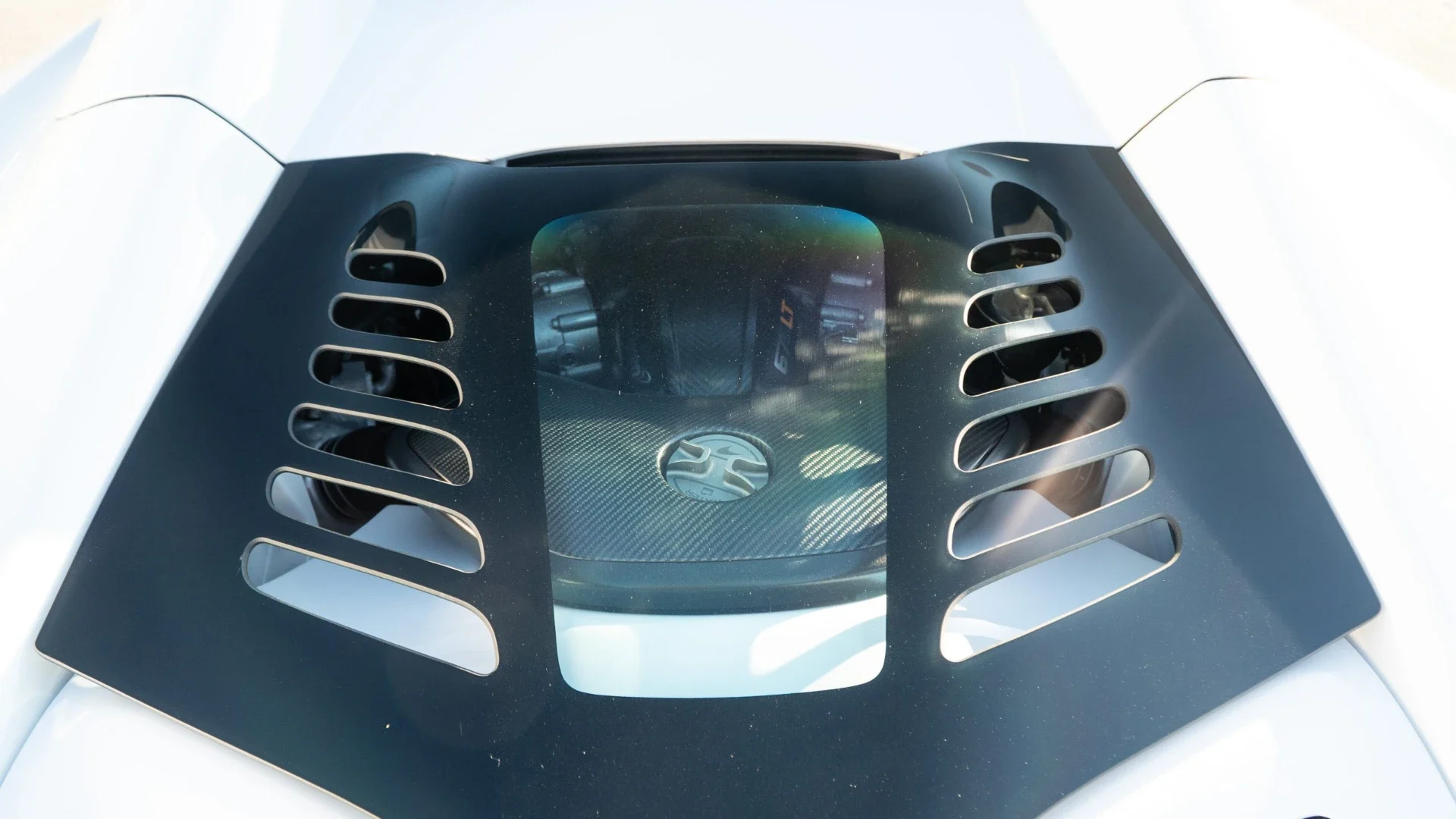 McLaren 675LT carbon engine cover with louvered vents over the bay