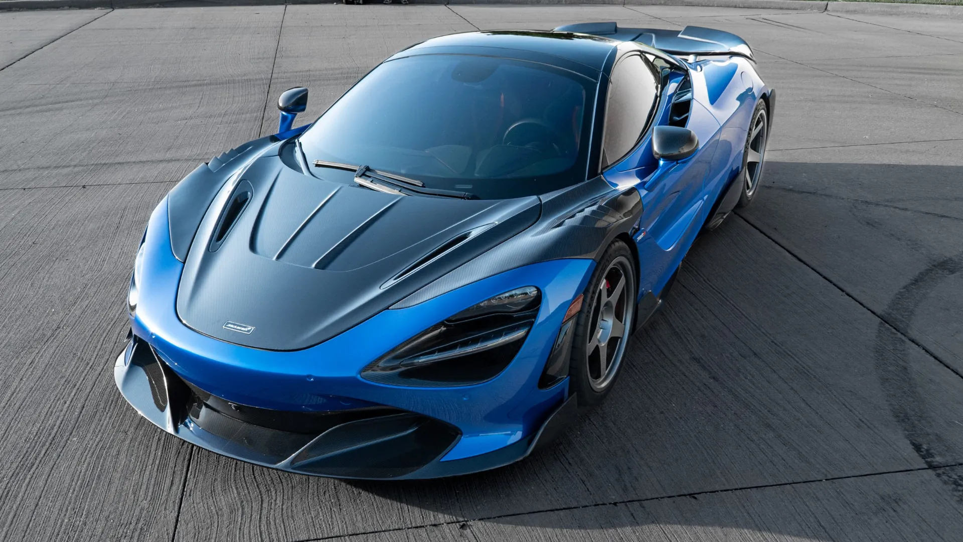 Blue McLaren 720S with full carbon fiber body kit, high front three-quarter view