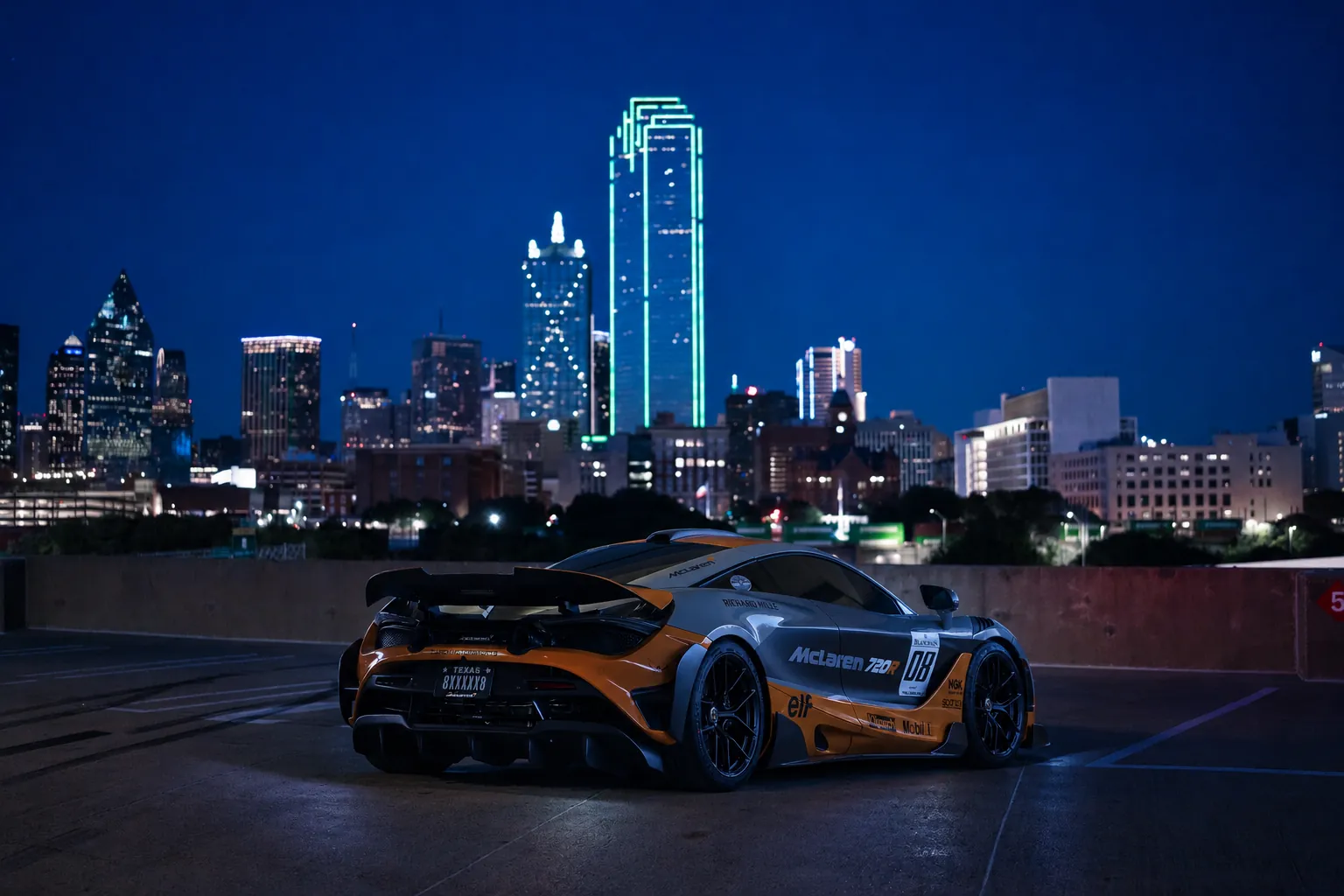 McLaren 720R track car at night against the Dallas skyline