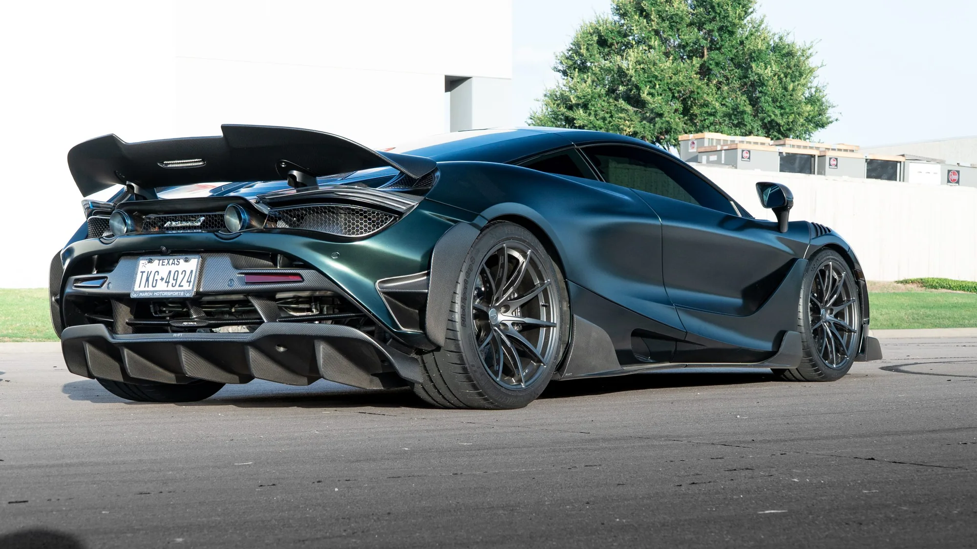Dark McLaren 720S rear three-quarter on MMCW3 wheels