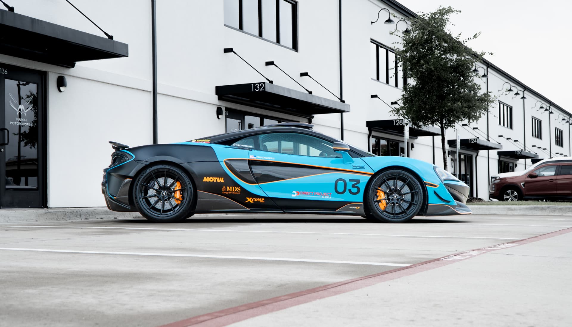 McLaren 600LT in Longtail Rally livery, side profile outside the March Motorsports shop