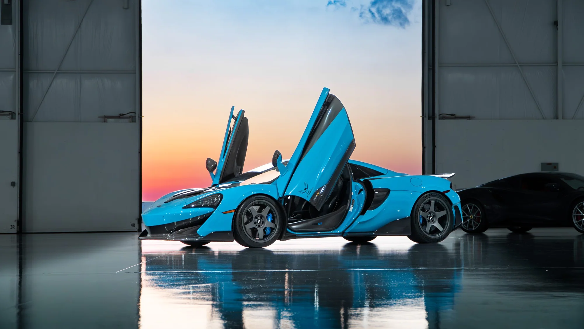 Blue McLaren rear three-quarter on MMCW2 wheels