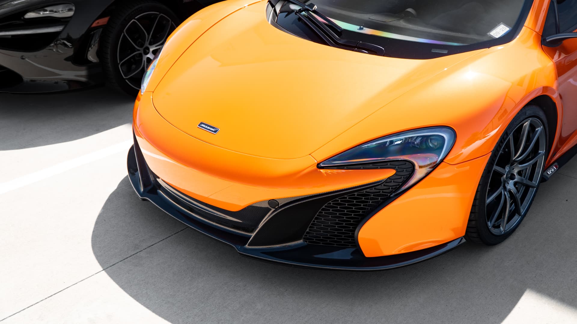 Orange McLaren 650S front detail with carbon splitter at March Motorsports