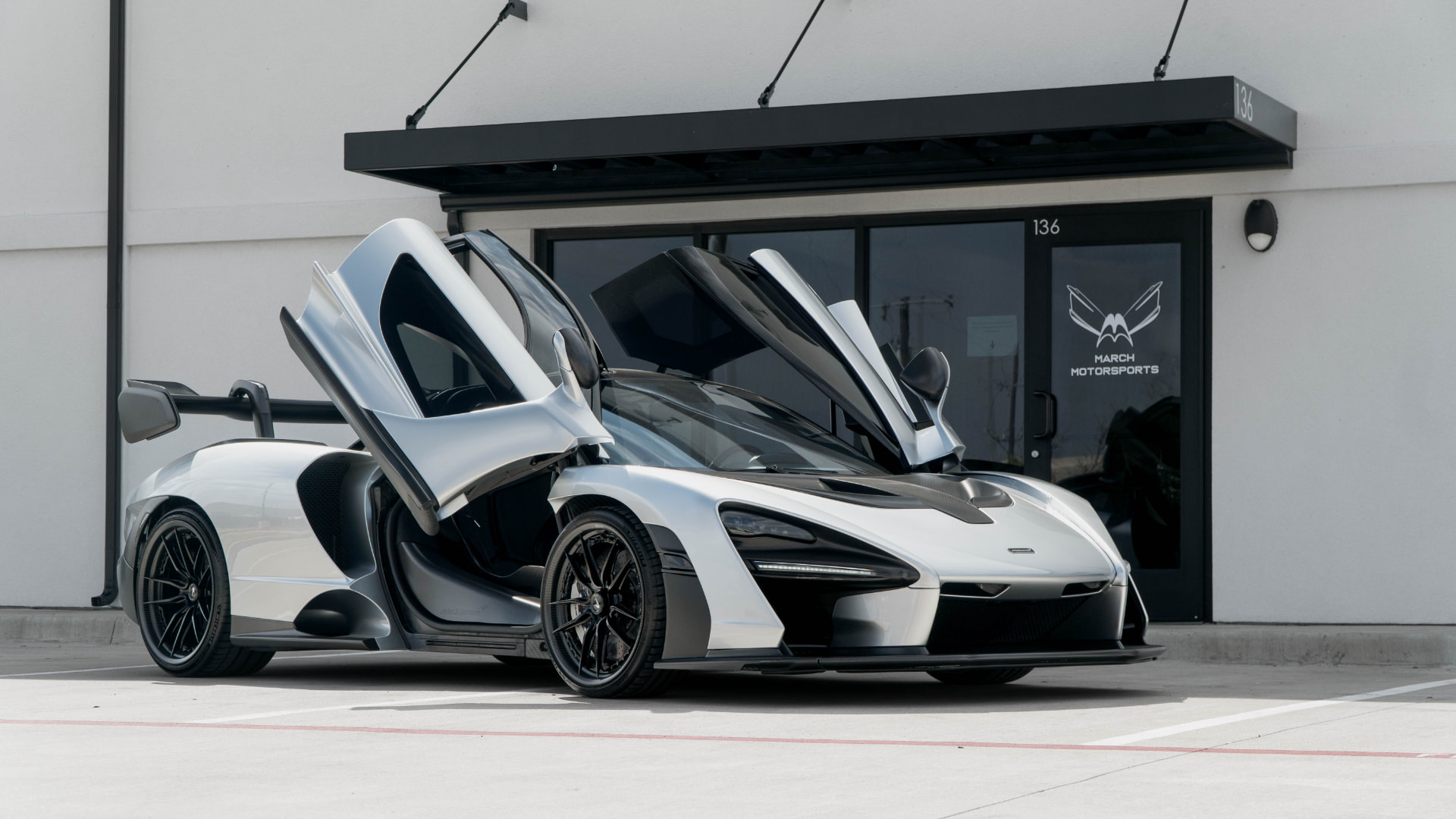 McLaren Senna with both dihedral doors open at the March Motorsports entrance