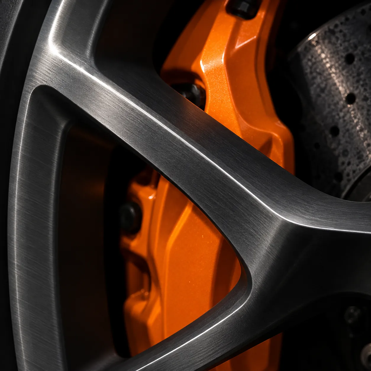 Stitched McLaren cabin leather that exposes the limits of the stock speakers