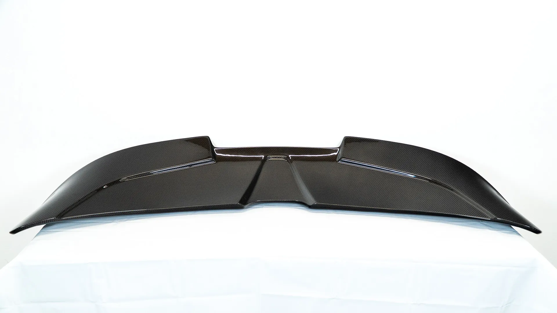 Full carbon fiber rear wing, front-on studio view