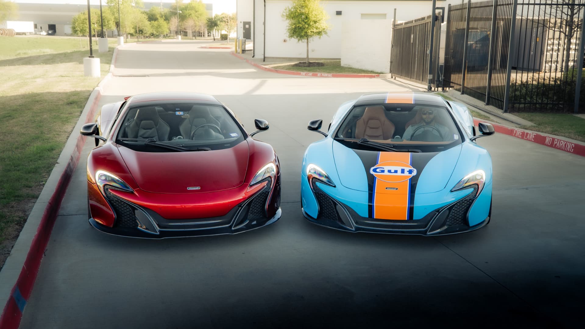Red and Gulf-liveried McLaren 650S Spiders parked outside March Motorsports