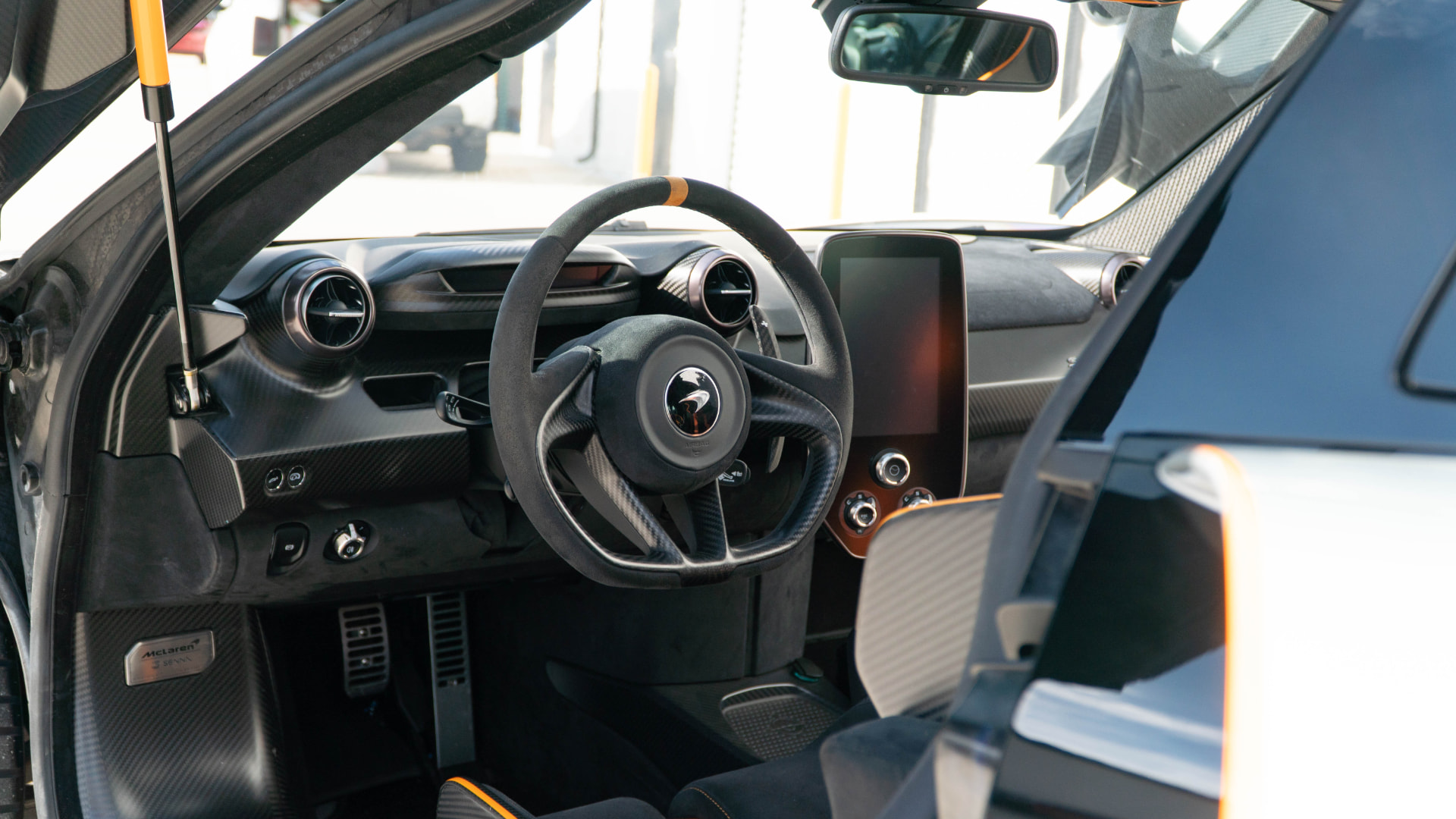 McLaren Senna cockpit through the open dihedral door at March Motorsports