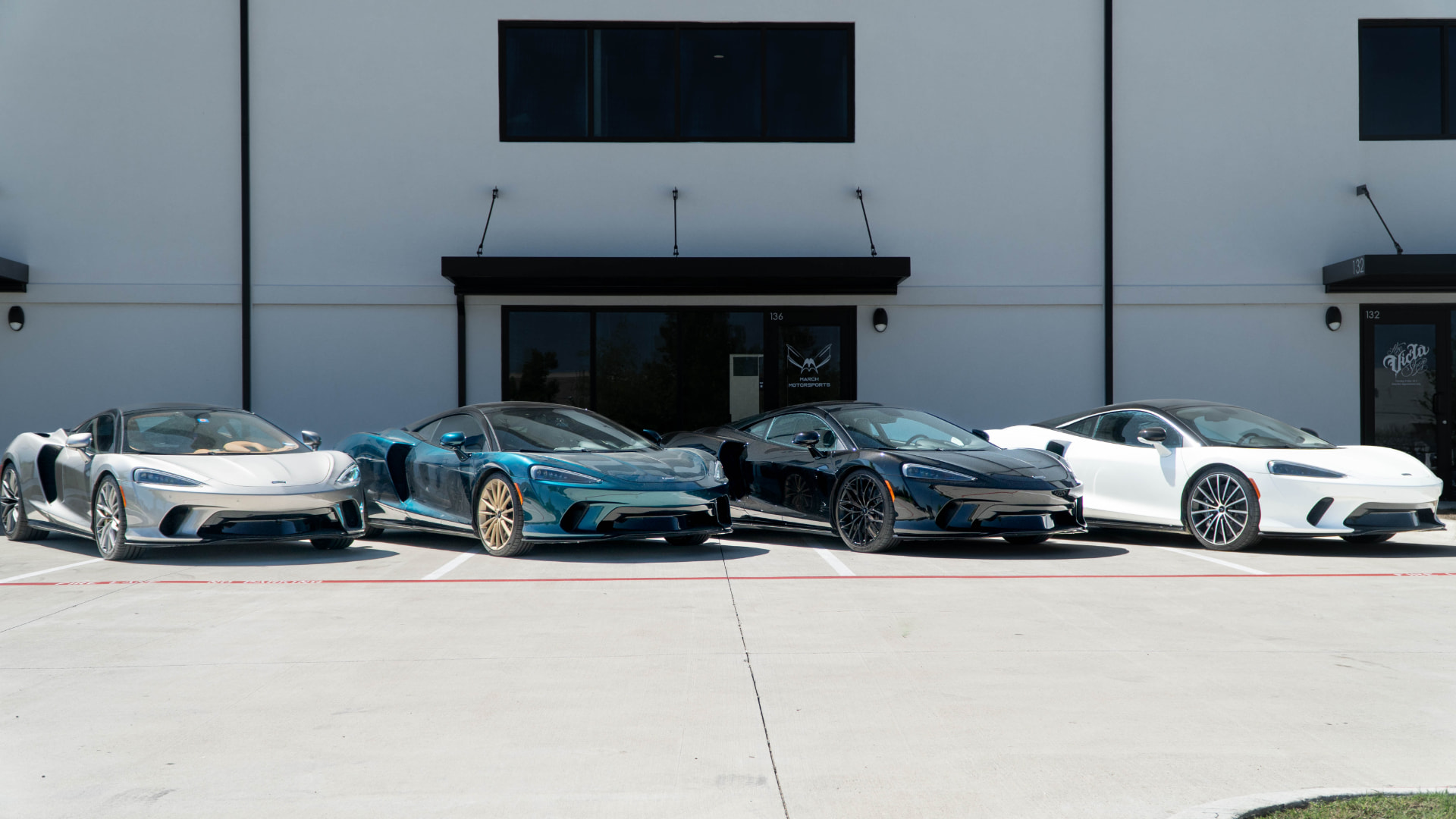 Four McLaren GTs lined up outside March Motorsports