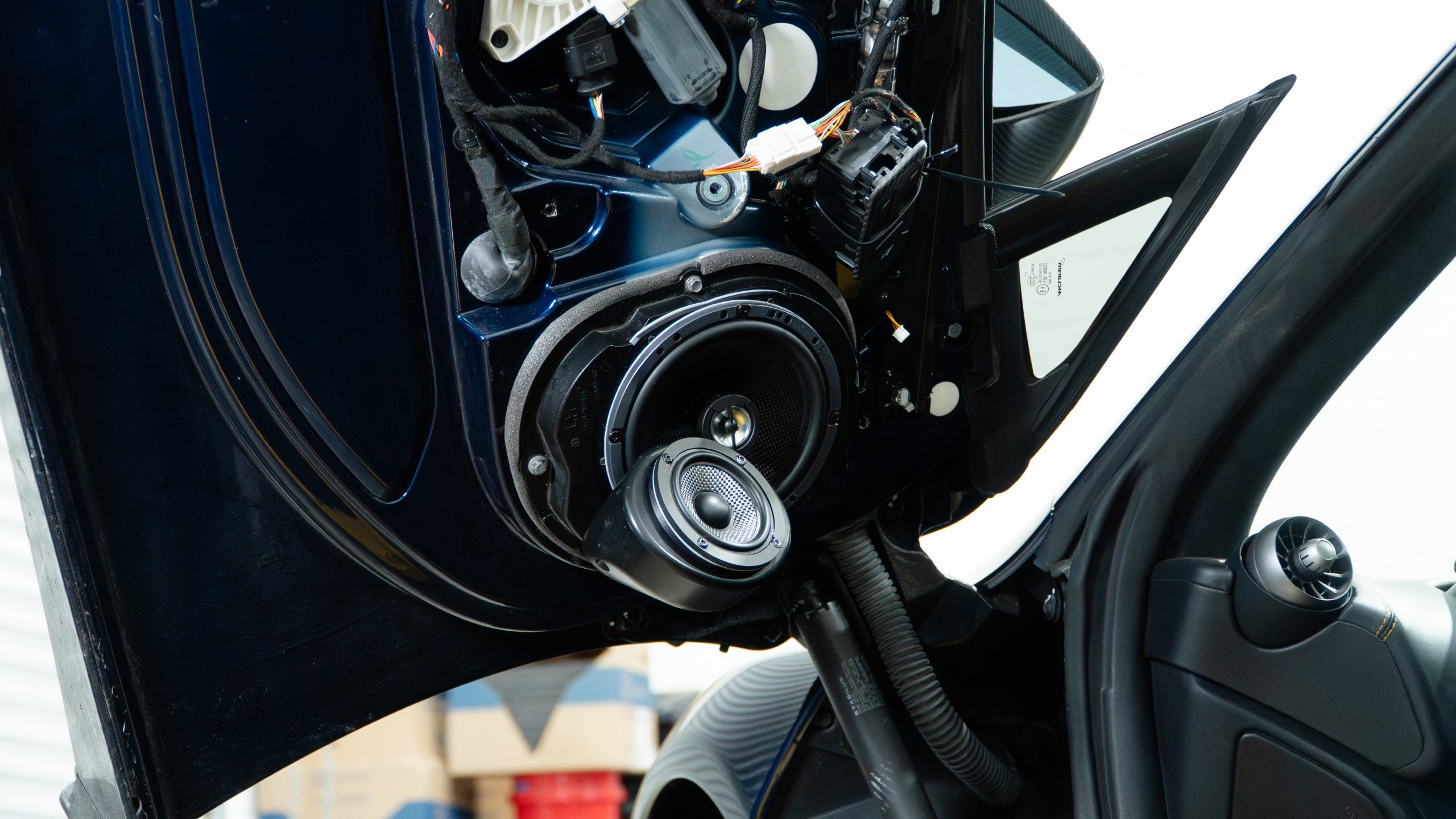 Upgraded mid driver installed in a McLaren door
