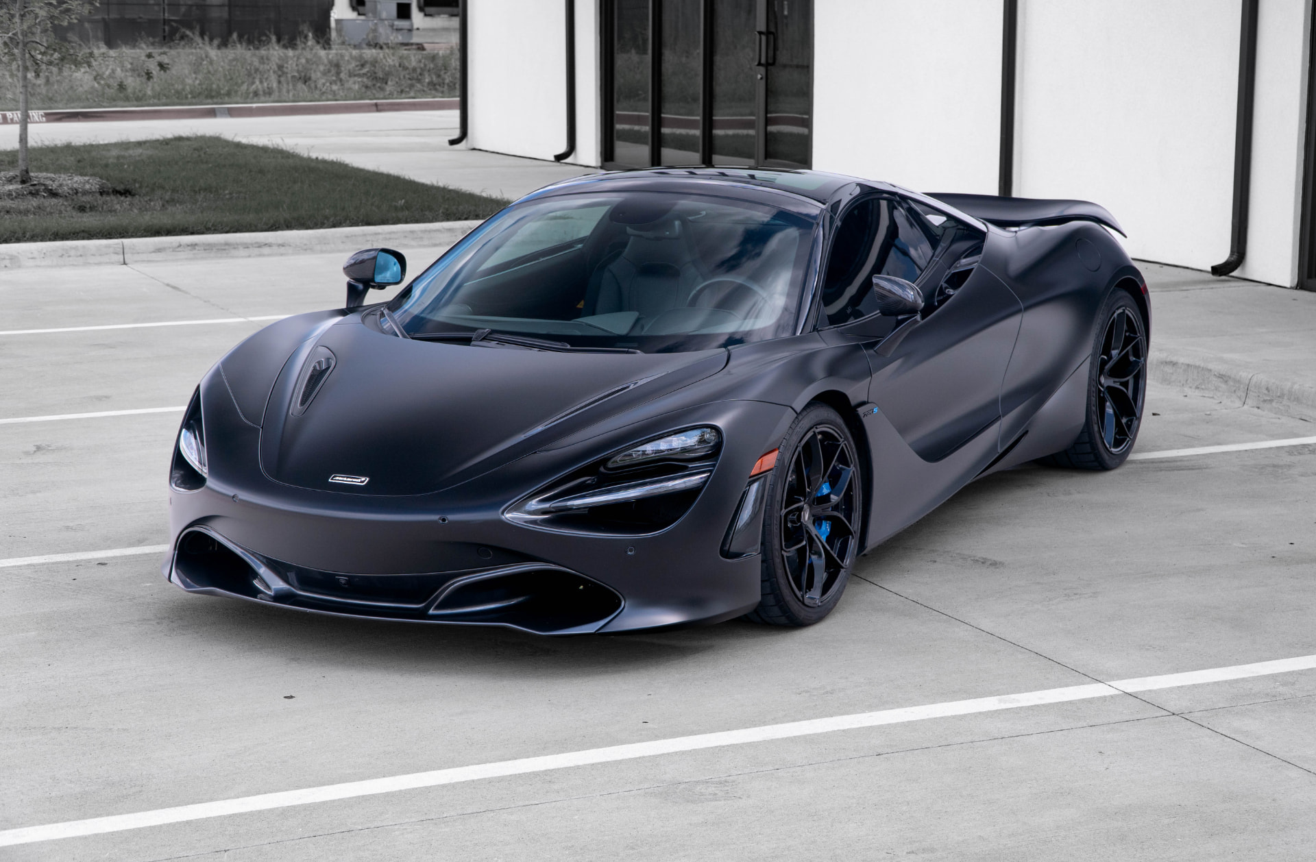 Satin dark grey McLaren 720S outside March Motorsports