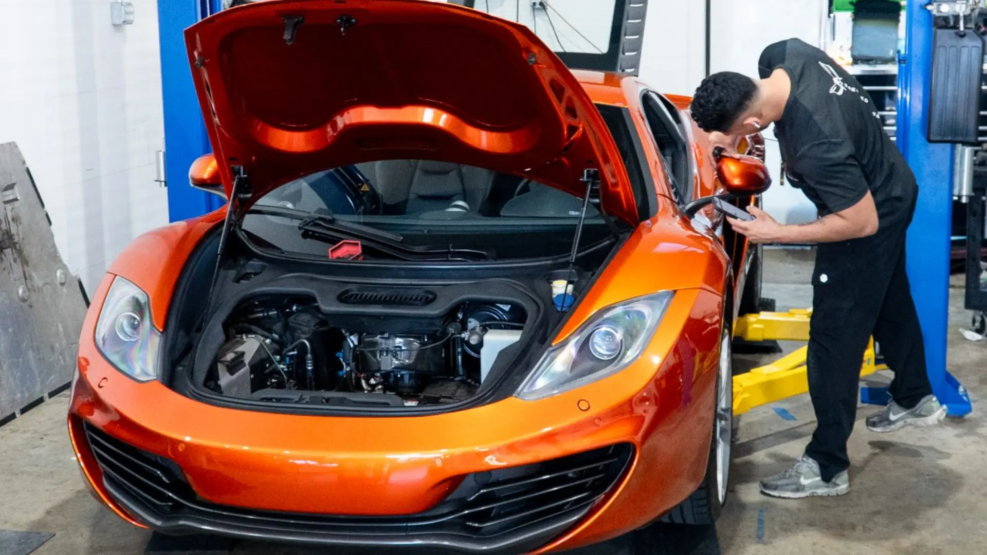 Engine bay inspection on a McLaren MP4-12C