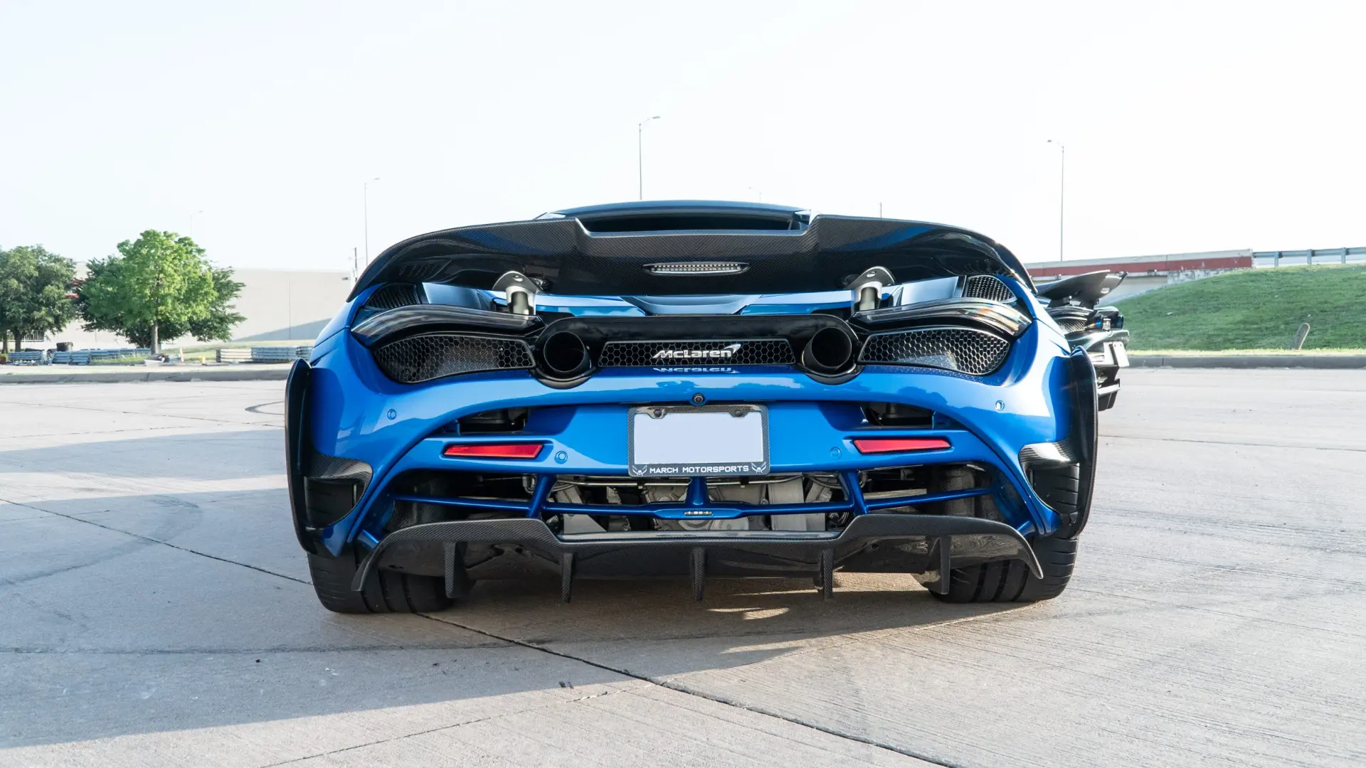 Blue McLaren 720S rear with the March Motorsports plate, carbon aero and exposed exhaust