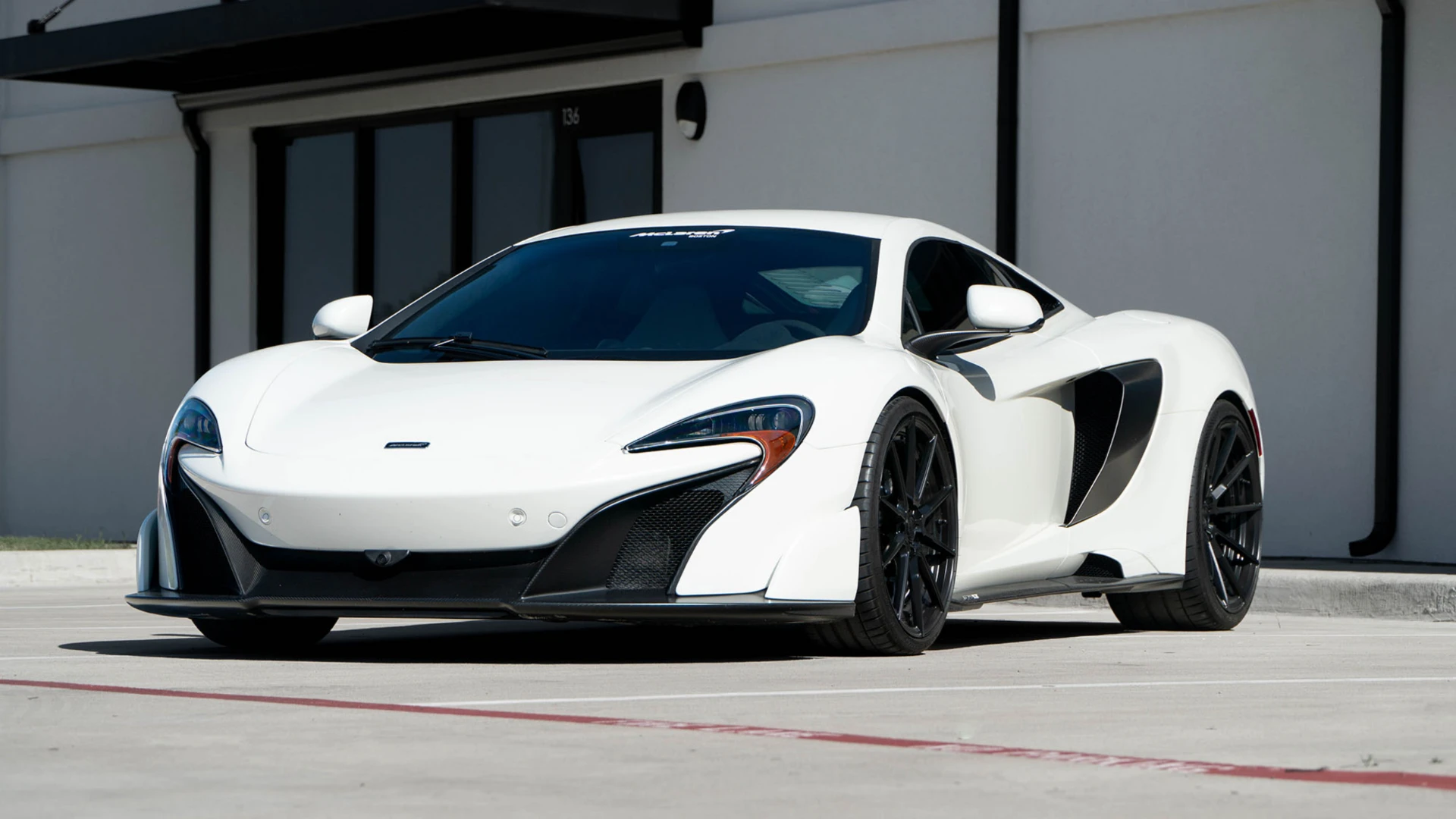 White McLaren 675LT outside March Motorsports