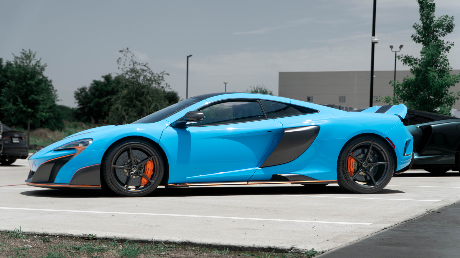 Blue McLaren 675LT coupe side profile outside March Motorsports
