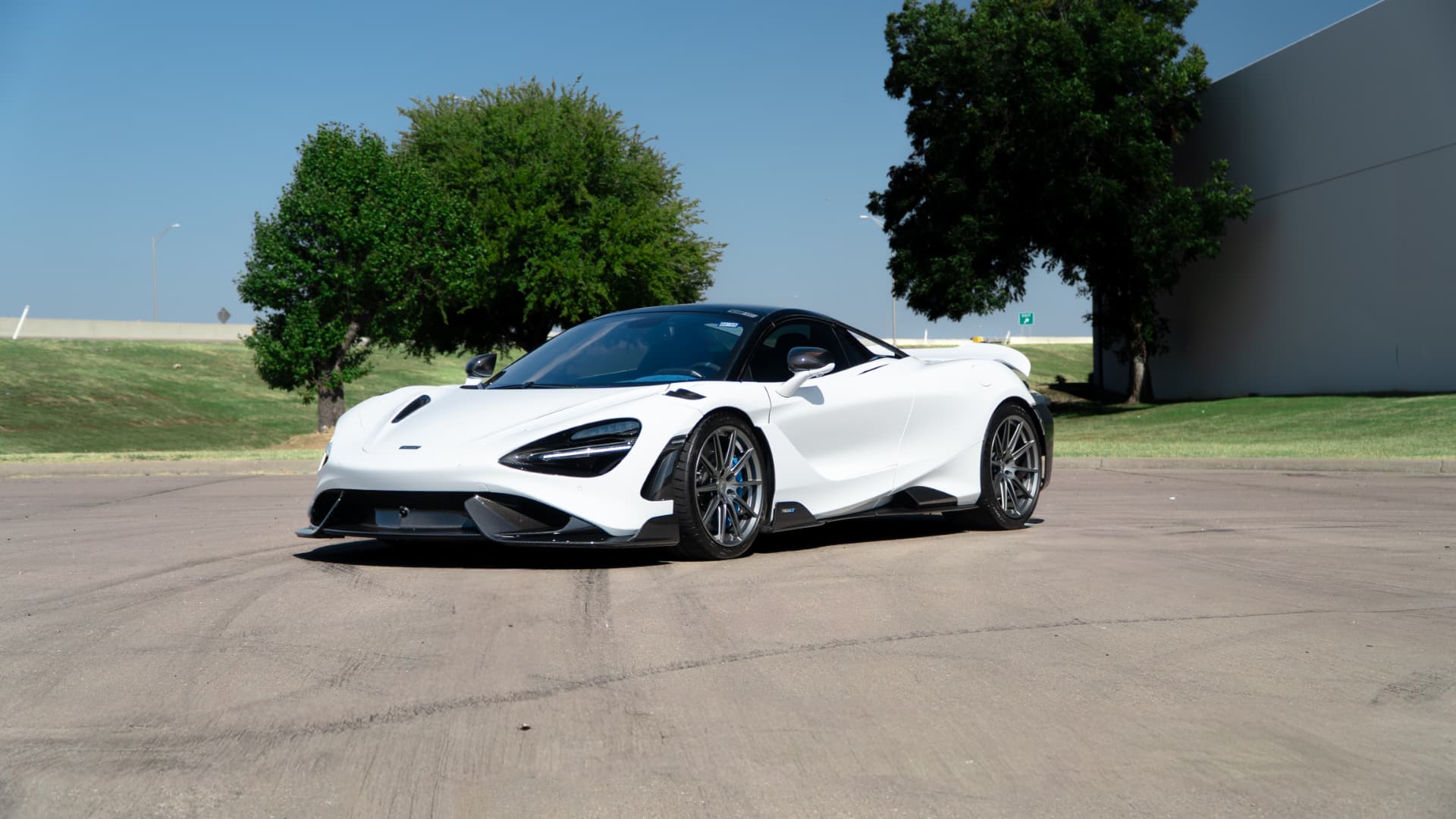 White McLaren 765LT front three-quarter view outdoors