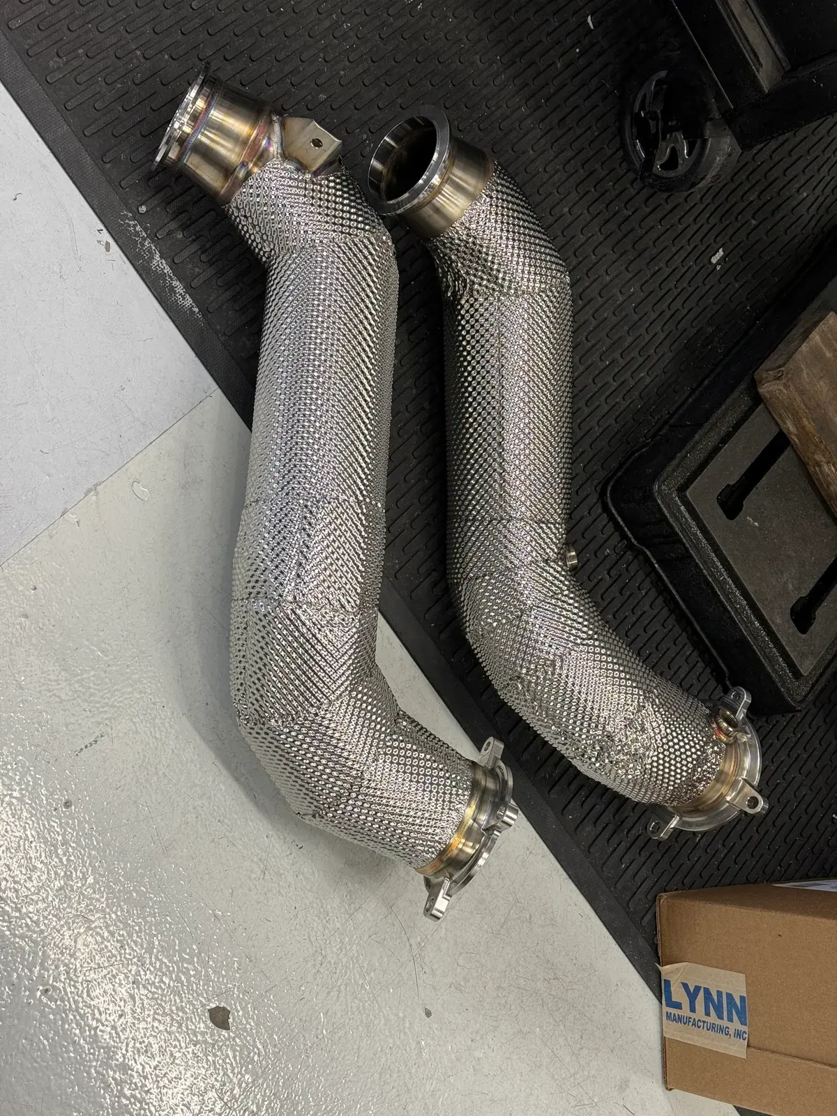 McLaren 750S downpipes being worked on in the March Motorsports workshop