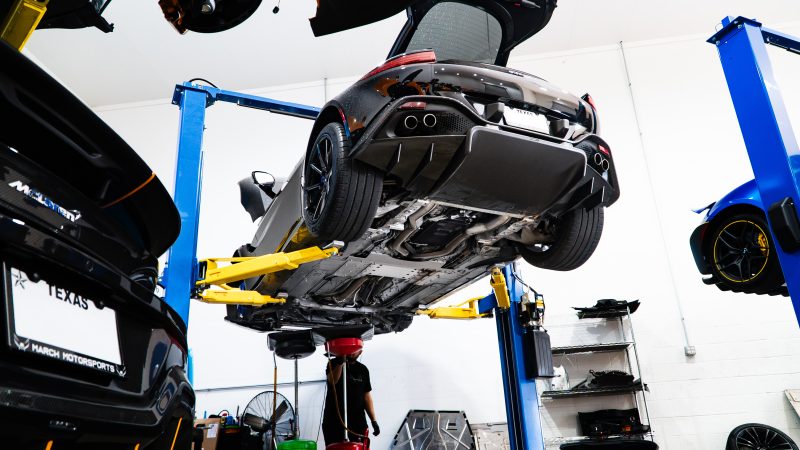 Aston Martin Vantage on a lift at March Motorsports