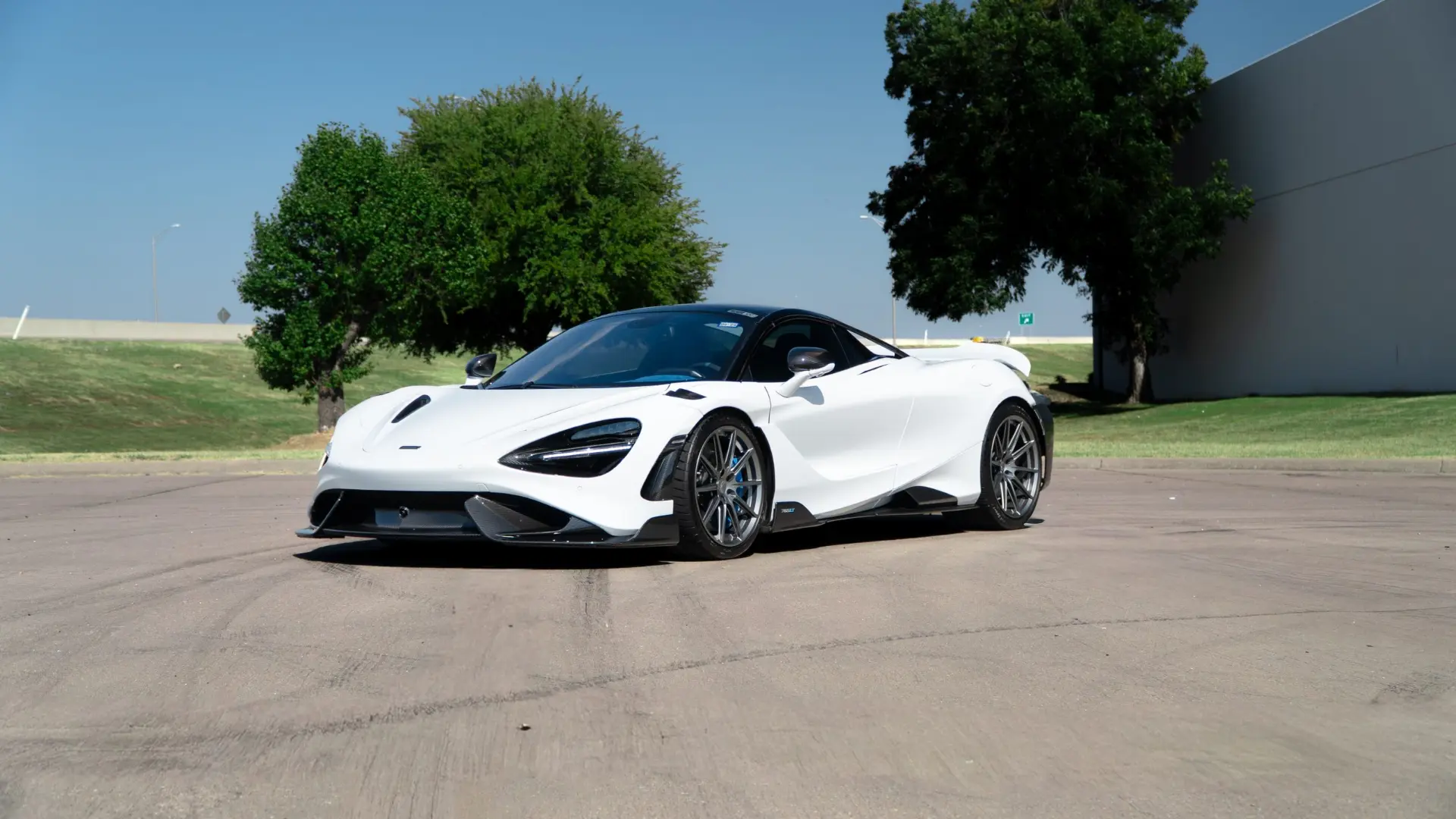 White McLaren 765LT parked outside March Motorsports