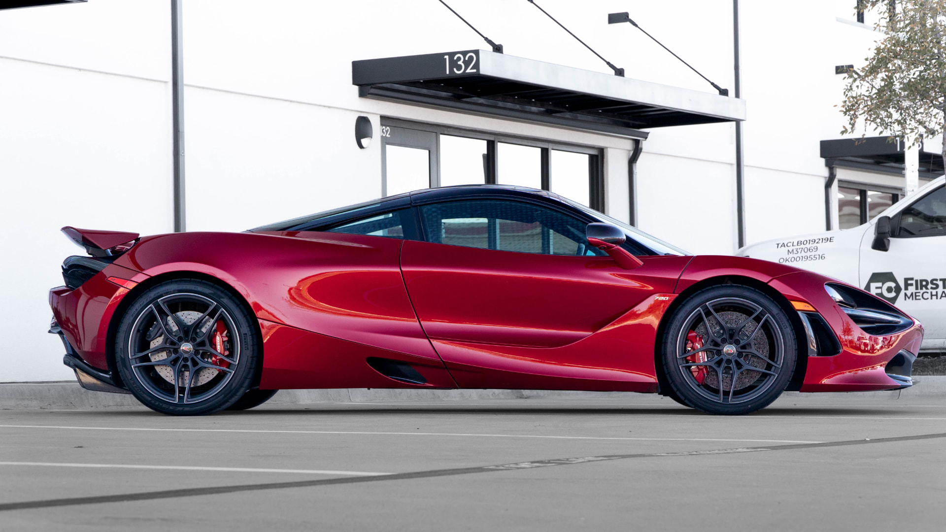 Red McLaren 720S side profile outside March Motorsports