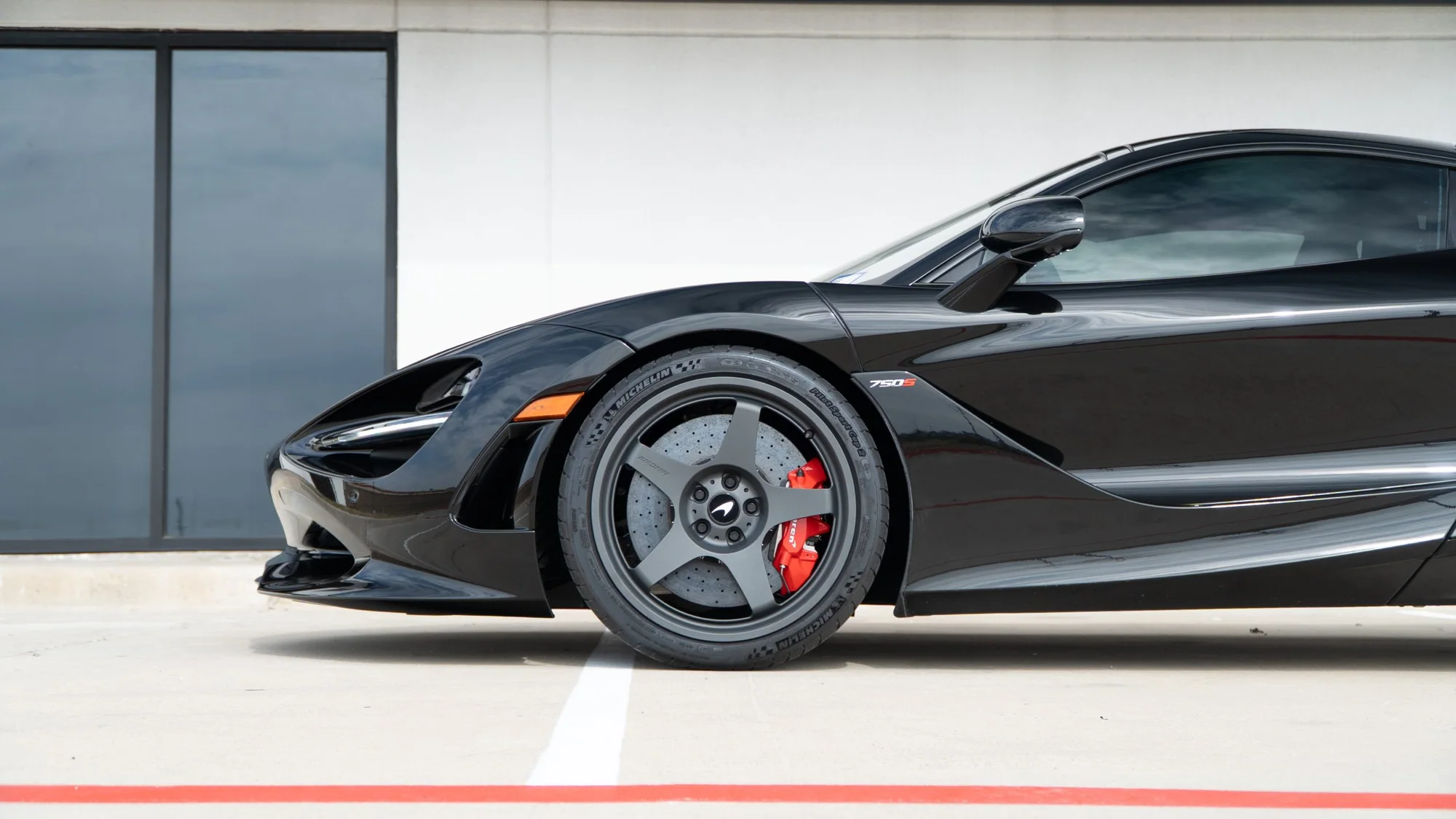 Black McLaren 750S side profile on MMCW2 wheels