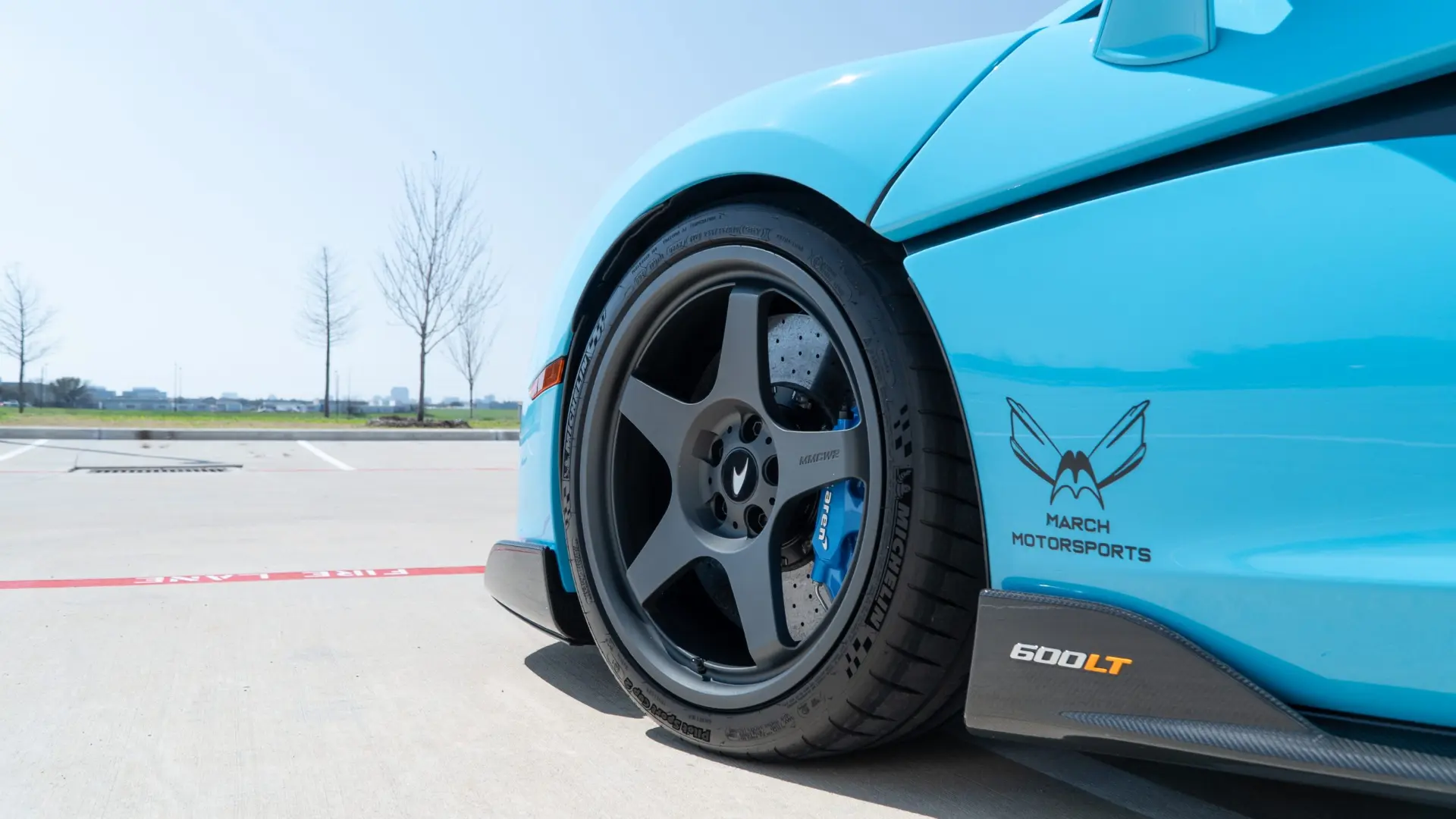 Wheel and brake work on a teal McLaren 600LT